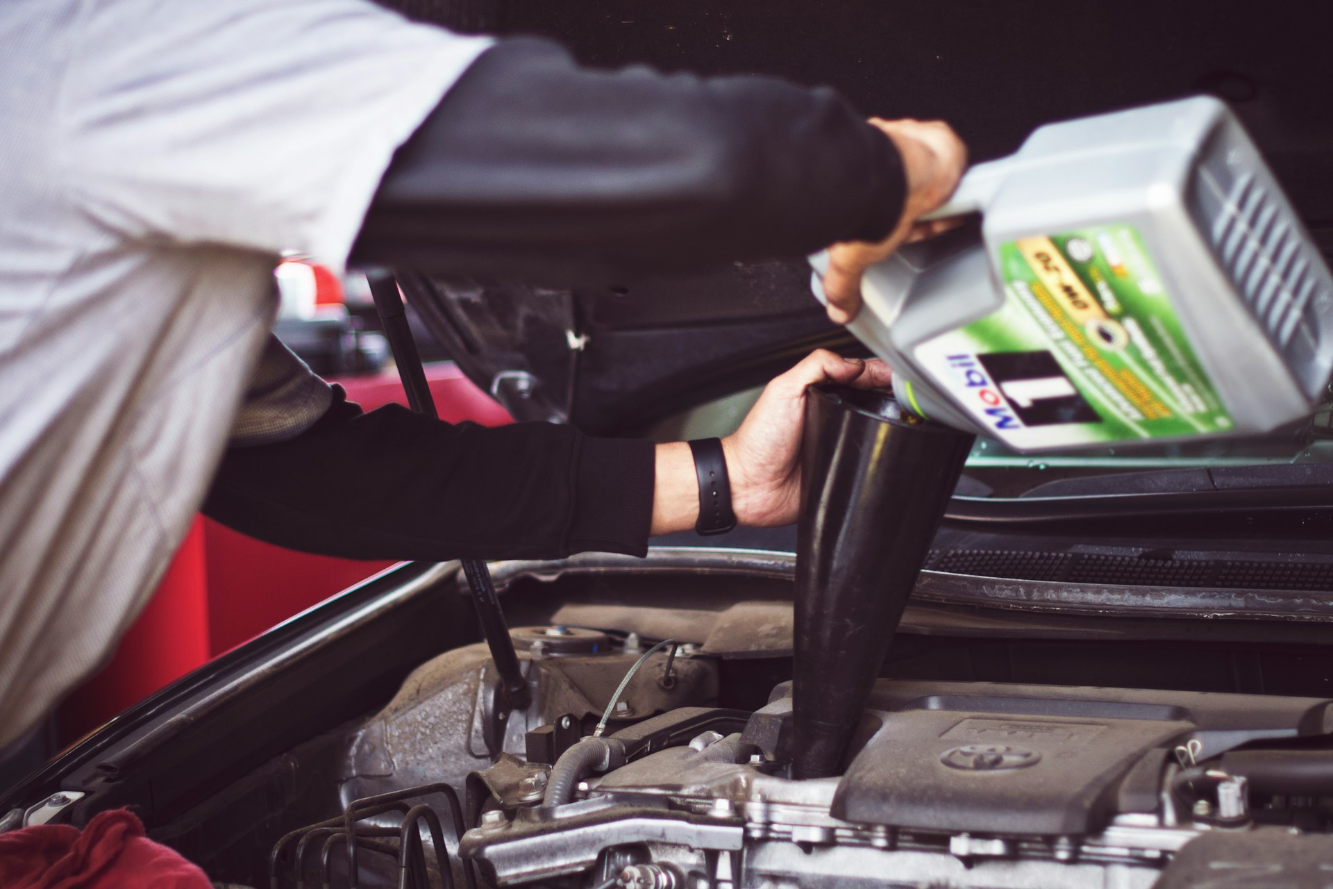 Mechanic Changing Car Oil